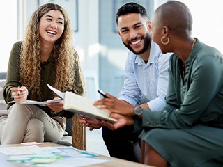 Group of coworkers smiling together in office