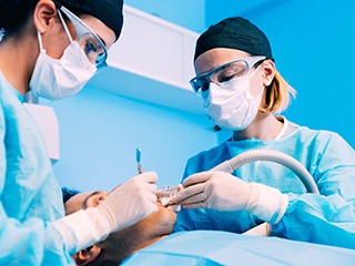 Dentists performing surgery