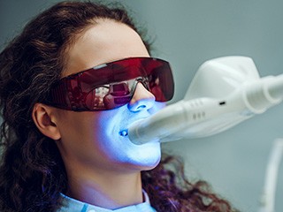 woman receiving teeth-whitening 